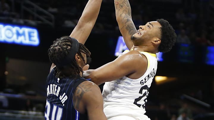 Utah Jazz guard Brice Sensabaugh (28) takes a shot as Orlando Magic center Wendell Carter Jr. (34) defends at Kia Center. Utah Jazz guard Brice Sensabaugh (28) takes a shot as Orlando Magic center Wendell Carter Jr. (34) defends at Kia Center.