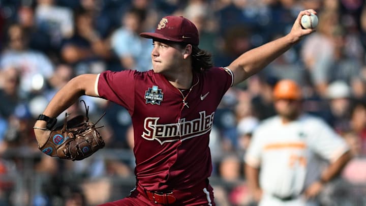 Florida State Seminoles starting pitcher Jamie Arnold (16) throw against the Tennessee Volunteers during the first inning at Charles Schwab Filed Omaha.
