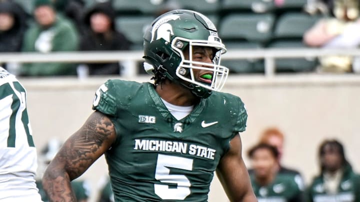 Michigan State's Jordan Hall, right, celebrates after a play during the Spring Showcase on Saturday, April 20, 2024, at Spartan Stadium in East Lansing.