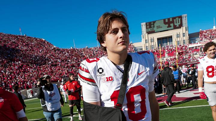 Ohio State Buckeyes quarterback Julian Sayin (10) leaves the field in a sling following the 19-15 win over the Indiana Hoosiers in the NCAA football game at Memorial Stadium Stadium in Bloomington, Ind. on Oct. 17, 2026. Ohio State Buckeyes quarterback Julian Sayin (10) leaves the field in a sling following the 19-15 win over the Indiana Hoosiers in the NCAA football game at Memorial Stadium Stadium in Bloomington, Ind. on Oct. 17, 2026.