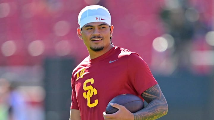 Oct 11, 2025; Los Angeles, California, USA;  USC Trojans quarterback Jayden Maiava (14) warms up prior to the game against the Michigan Wolverines at United Airlines Field at the Los Angeles Memorial Coliseum. Mandatory Credit: Jayne Kamin-Oncea-Imagn Images