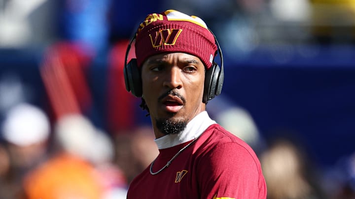Nov 3, 2024; East Rutherford, New Jersey, USA; Washington Commanders quarterback Jayden Daniels (5) warms up before the game against the New York Giants at MetLife Stadium. Mandatory Credit: Vincent Carchietta-Imagn Images