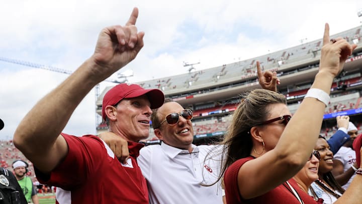 Oklahoma Sooners head coach Brent Venables (left) celebrates with OU president Joseph Harroz after beating Nebraska. Oklahoma Sooners head coach Brent Venables (left) celebrates with OU president Joseph Harroz after beating Nebraska.