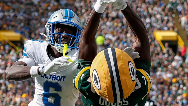 Detroit Lions cornerback Terrion Arnold (6) breaks up a pass intended for Packers wide receiver Romeo Doubs (87)
