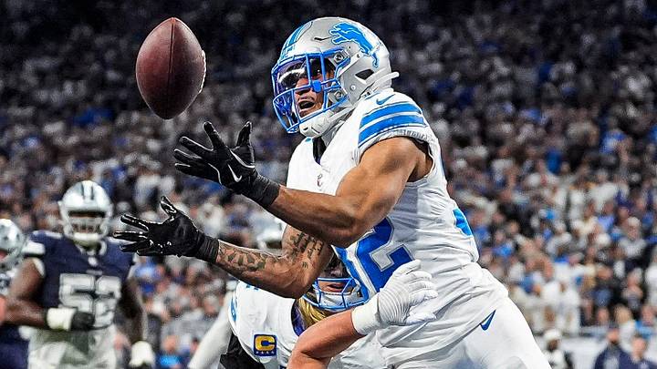 Detroit Lions safety Brian Branch (32) tries to intercept a pass intended for Dallas Cowboys tight end Jake Ferguson (87) during the second half at Ford Field in Detroit on Thursday, Dec. 4, 2025. Detroit Lions safety Brian Branch (32) tries to intercept a pass intended for Dallas Cowboys tight end Jake Ferguson (87) during the second half at Ford Field in Detroit on Thursday, Dec. 4, 2025.
