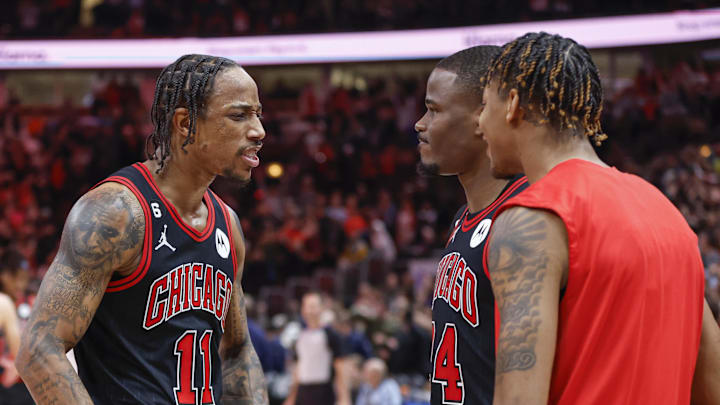 Dec 28, 2022; Chicago, Illinois, USA; Chicago Bulls forward DeMar DeRozan (11) celebrates with  forward Javonte Green (24) and forward Dalen Terry (25) team's win against the Milwaukee Bucks in overtime at United Center. Mandatory Credit: Kamil Krzaczynski-Imagn Images