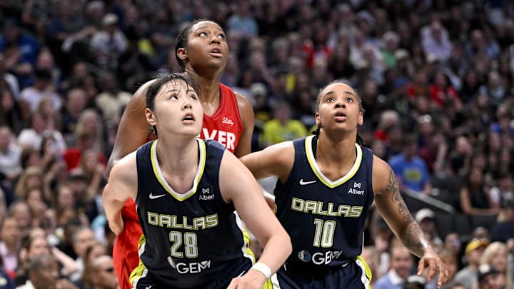 Jun 27, 2025; Dallas, Texas, USA; Dallas Wings center Li Yueru (28) and guard Aziaha James (10) in action during the game between the Dallas Wings and the Indiana Fever at the American Airlines Center. Mandatory Credit: Jerome Miron-Imagn Images