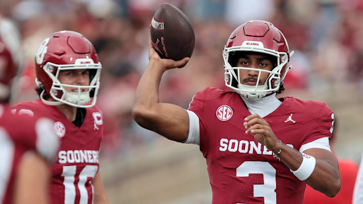 Quarterback Michael Hawkins Jr. #3 of the Oklahoma Sooners throws a pass as quarterback John Mateer #10 watches before a game against the Illinois State Redbirds at Gaylord Family Oklahoma Memorial Stadium on August 30, 2025 in Norman, Oklahoma. Oklahoma won 35-3.