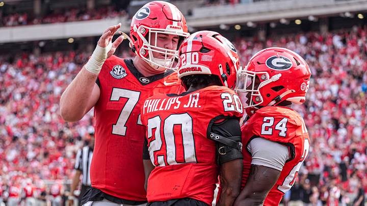 Georgia football players in their classic Silver Britches, red tops and red helmets.