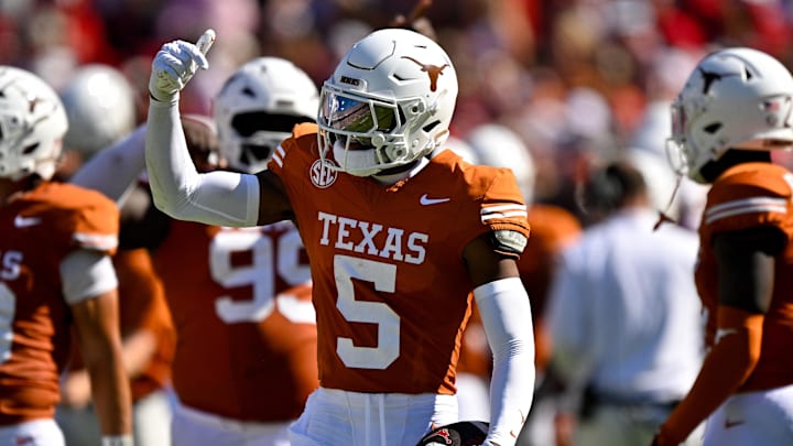Texas Longhorns defensive back Malik Muhammad celebrates after he intercepts a pass thrown by Oklahoma Sooners quarterback John Mateer during the first half at the Cotton Bowl. 