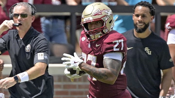 Sep 6, 2025; Tallahassee, Florida, USA; Florida State Seminoles running back Gavin Sawchuck (27) runs down the sideline for a touchdown during the second half against the East Texas A&M Lions at Doak S. Campbell Stadium. Mandatory Credit: Melina Myers-Imagn Images