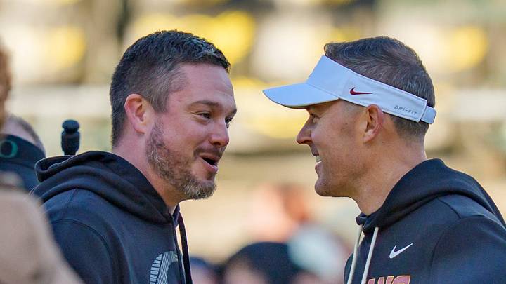 Oregon head coach Dan Lanning, left, and USC head coach Lincoln Riley shake hands before the game as the Oregon Ducks host the USC Trojans on Nov. 22, 2025, at Autzen Stadium in Eugene, Oregon Oregon head coach Dan Lanning, left, and USC head coach Lincoln Riley shake hands before the game as the Oregon Ducks host the USC Trojans on Nov. 22, 2025, at Autzen Stadium in Eugene, Oregon