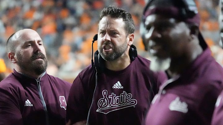 Mississippi State Bulldogs defensive coordinator Coleman Hutzler is held back by assistant coach Matt Holecek as he yells at officials as on a pass interference call against the Tennessee Volunteers during the second half at Neyland Stadium. Mississippi State Bulldogs defensive coordinator Coleman Hutzler is held back by assistant coach Matt Holecek as he yells at officials as on a pass interference call against the Tennessee Volunteers during the second half at Neyland Stadium.