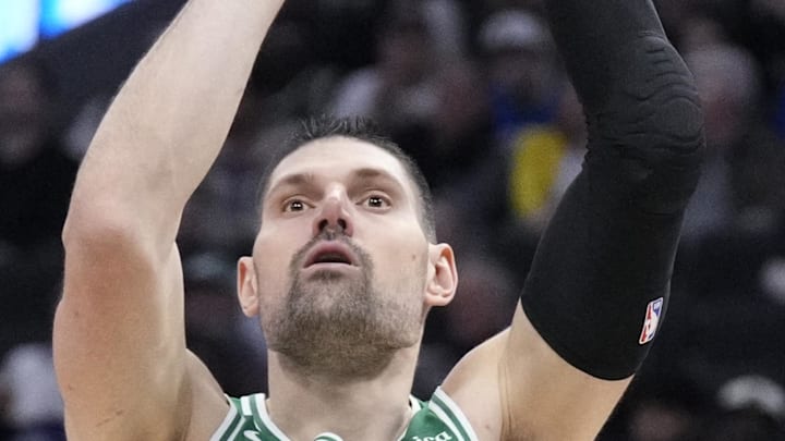 Mar 2, 2026; Milwaukee, Wisconsin, USA; Boston Celtics center Nikola Vucevic (4) shoots the ball against Milwaukee Bucks forward Bobby Portis (9) in the second half at Fiserv Forum. Mandatory Credit: Michael McLoone-Imagn Images