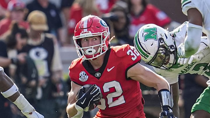 Aug 30, 2025; Athens, Georgia, USA; Georgia Bulldogs running back Cash Jones (32) runs with the ball against the Marshall Thundering Herd at Sanford Stadium. Mandatory Credit: Dale Zanine-Imagn Images