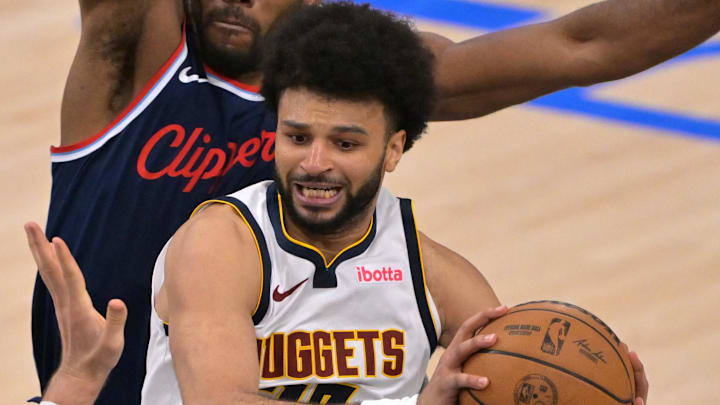 Apr 26, 2025; Inglewood, California, USA; Denver Nuggets guard Jamal Murray (27) is defended by Los Angeles Clippers center Ivica Zubac (40) and forward Kawhi Leonard (2) in the second half of game four of round one of the 2024 NBA Playoffs at Intuit Dome. Mandatory Credit: Jayne Kamin-Oncea-Imagn Images Apr 26, 2025; Inglewood, California, USA; Denver Nuggets guard Jamal Murray (27) is defended by Los Angeles Clippers center Ivica Zubac (40) and forward Kawhi Leonard (2) in the second half of game four of round one of the 2024 NBA Playoffs at Intuit Dome. Mandatory Credit: Jayne Kamin-Oncea-Imagn Images