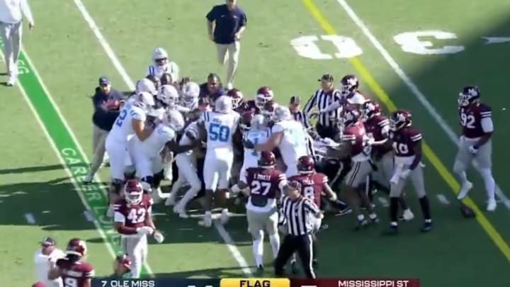 Ole Miss, Mississippi State players shove each other after a loose ball early in the Egg Bowl. Ole Miss, Mississippi State players shove each other after a loose ball early in the Egg Bowl.