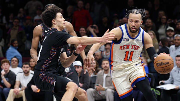 Mar 20, 2026; Brooklyn, New York, USA; New York Knicks guard Jalen Brunson (11) is fouled by Brooklyn Nets guard Nolan Traore (88) during the second half at Barclays Center. Mandatory Credit: Vincent Carchietta-Imagn Images