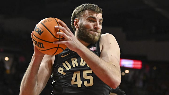 Purdue Boilermakers center Oscar Cluff (45) pulls down  a rebound.