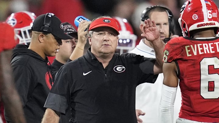 Sep 27, 2025; Athens, Georgia, USA; Georgia Bulldogs head coach Kirby Smart reacts with defensive back Daylen Everette (6) in the first half against the Alabama Crimson Tide at Sanford Stadium. Mandatory Credit: Brett Davis-Imagn Images
