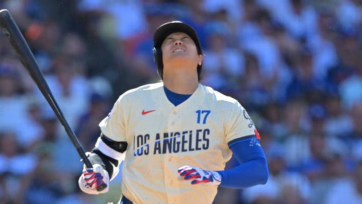 Los Angeles, California, USA;  Los Angeles Dodgers two-way player Shohei Ohtani (17) reacts after hitting a foul ball off of his knee during the first inning against the Pittsburgh Pirates at UNIQLO Field at Dodger Stadium.  Mandatory Credit: Jayne Kamin-Oncea-Imagn Images