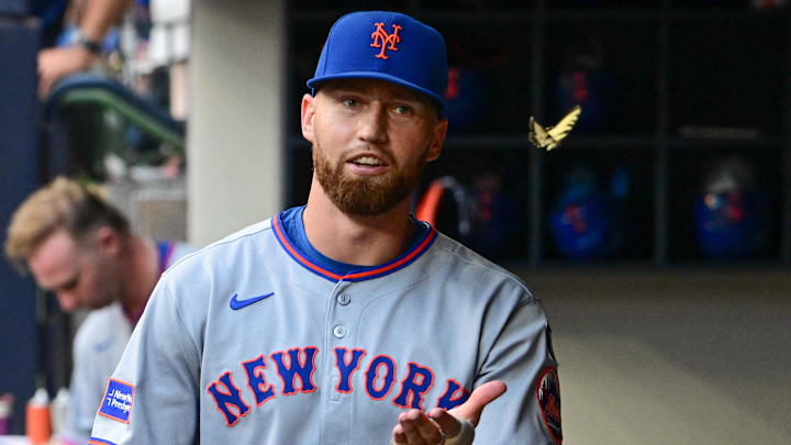 Aug 8, 2025; Milwaukee, Wisconsin, USA; New York Mets left fielder Brandon Nimmo (9) chases a butterfly in the dugout during game against the Milwaukee Brewers at American Family Field. Mandatory Credit: Benny Sieu-Imagn Images