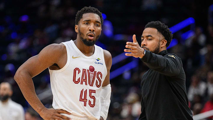 Oct 26, 2024; Washington, District of Columbia, USA; Cleveland Cavaliers guard Donovan Mitchell (45) speaks to Cleveland Cavaliers associate head coach Johnnie
Bryant during a time out in the third quarter against the Washington Wizards at Capital One Arena. Mandatory Credit: Reggie Hildred-Imagn Images