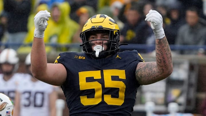 Michigan defensive lineman Mason Graham celebrates after sacking Minnesota quarterback Max Brosmer, in the background, during first-half action between Michigan and Minnesota at Michigan Stadium in Ann Arbor on Saturday, Sept. 28, 2024. Michigan defensive lineman Mason Graham celebrates after sacking Minnesota quarterback Max Brosmer, in the background, during first-half action between Michigan and Minnesota at Michigan Stadium in Ann Arbor on Saturday, Sept. 28, 2024.