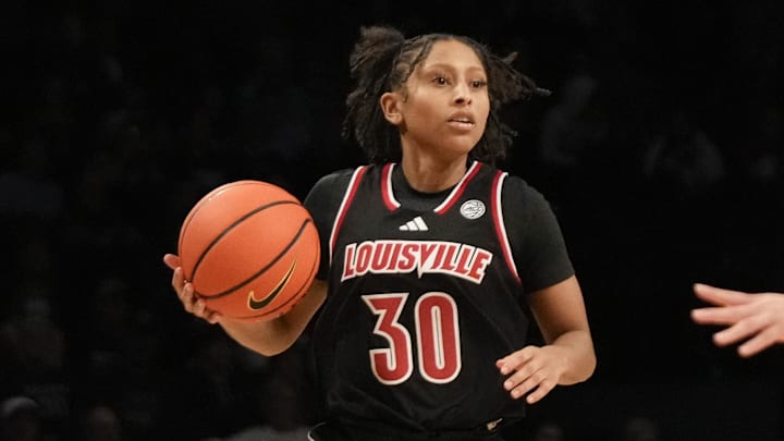 Dec 7, 2024; Brooklyn, New York, USA; Louisville Cardinals guard Jayda Curry (30) is defended by Connecticut Huskies guard Kaitlyn Chen (20) during the second half at Barclays Center. Dec 7, 2024; Brooklyn, New York, USA; Louisville Cardinals guard Jayda Curry (30) is defended by Connecticut Huskies guard Kaitlyn Chen (20) during the second half at Barclays Center.