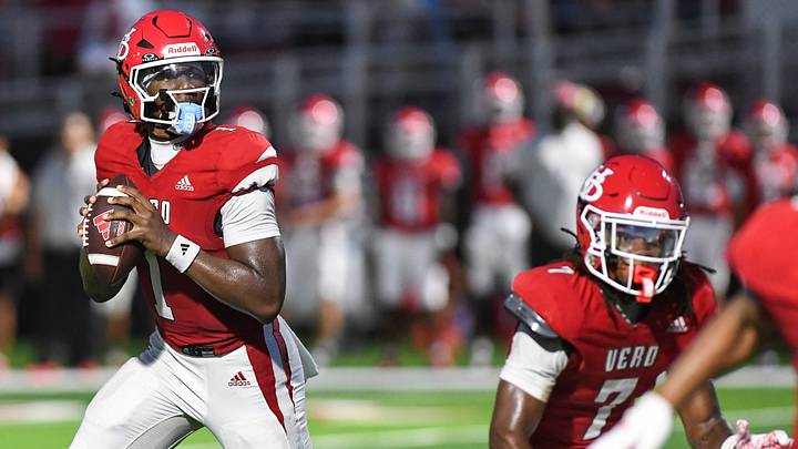 Vero Beach quarterback Champ Monds (1), a Notre Dame commit, looks to throw during the school's Kickoff Classic against Cardinal Newman on Aug. 14, 2026. Monds has led the Indians to a 2-0 start entering Friday's matchup with national power St. Frances Academy.