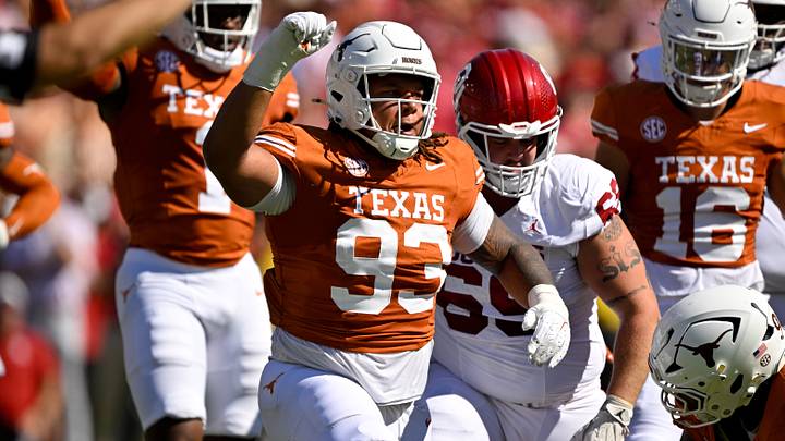 Texas Longhorns defensive tackle Hero Kanu (93) celebrates during the game between the Texas Longhorns and the Oklahoma Sooners at the Cotton Bowl. 