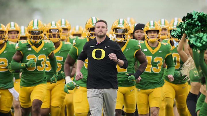 Nov 9, 2024; Eugene, Oregon, USA; Oregon Ducks head coach Dan Lanning leads his team before the start of a game against the Maryland Terrapins at Autzen Stadium. Mandatory Credit: Troy Wayrynen-Imagn Images