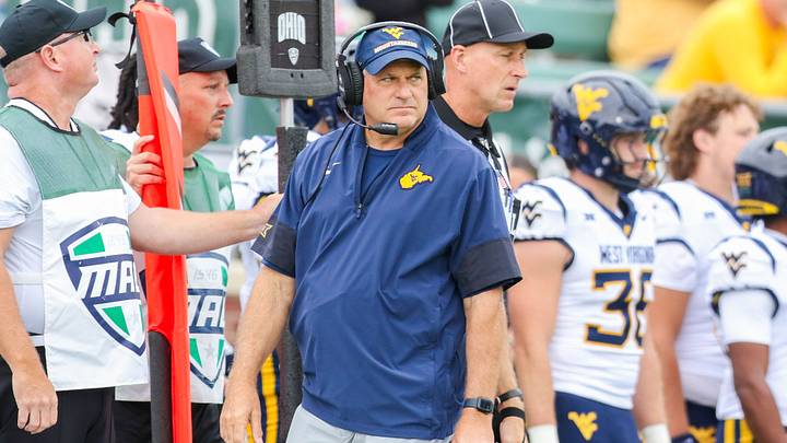 Sep 6, 2025; Athens, Ohio, USA; West Virginia Mountaineers head coach Rich Rodriguez walks along the sidelines during the first quarter against the Ohio Bobcats at Peden Stadium. Mandatory Credit: Ben Queen-Imagn Images