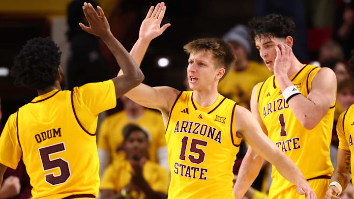 Jan 24, 2026; Tempe, Arizona, USA; Arizona State Sun Devils guard Maurice Odum (5) celebrates with teammate Noah Meeusen (15) against the Cincinnati Bearcats in the first half at Desert Financial Arena. Mandatory Credit: Mark J. Rebilas-Imagn Images