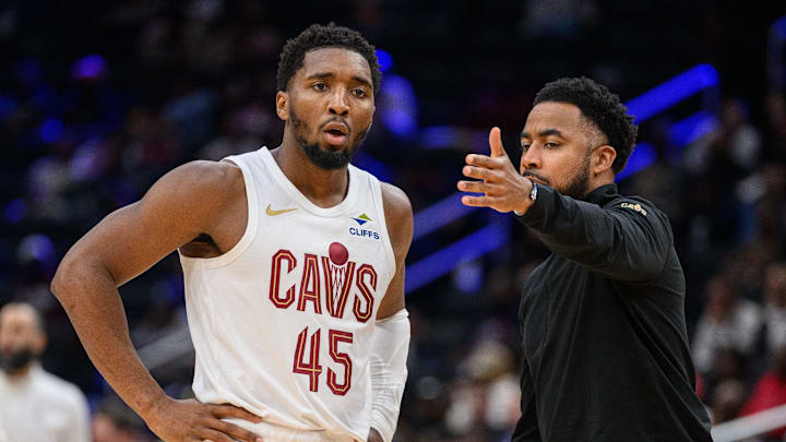 Oct 26, 2024; Washington, District of Columbia, USA; Cleveland Cavaliers guard Donovan Mitchell (45) speaks to Cleveland Cavaliers associate head coach Johnnie
Bryant during a time out in the third quarter against the Washington Wizards at Capital One Arena. Mandatory Credit: Reggie Hildred-Imagn Images