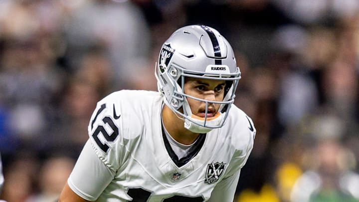 Dec 29, 2024; New Orleans, Louisiana, USA;  Las Vegas Raiders quarterback Aidan O'Connell (12) calls for the ball against the New Orleans Saints during the first half at Caesars Superdome. Mandatory Credit: Stephen Lew-Imagn Images