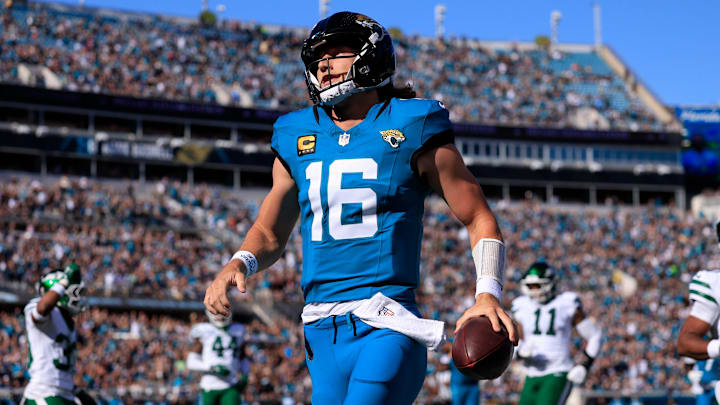 Jacksonville Jaguars quarterback Trevor Lawrence (16) scores a touchdown on a keeper during the first quarter of an NFL football matchup at EverBank Stadium, Sunday, Dec. 14, 2025, in Jacksonville, Fla. [Corey Perrine/Florida Times-Union]