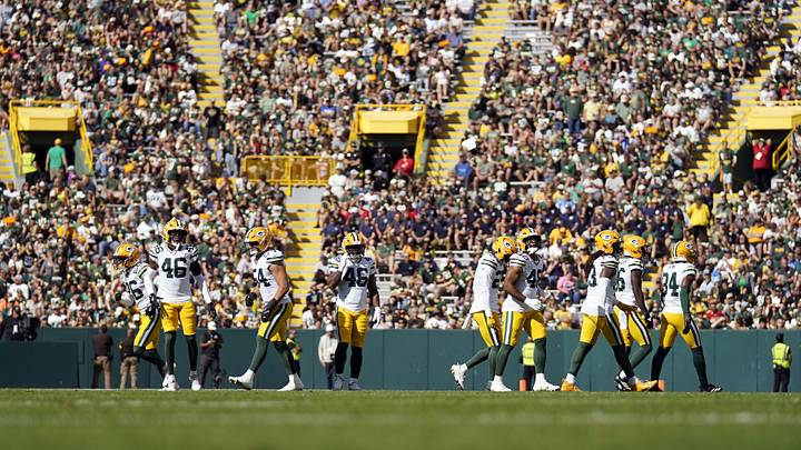 Aug 23, 2025; Green Bay, Wisconsin, USA;  Green Bay Packers players break from a huddle to line up against the Seattle Seahawks during the first half at Lambeau Field. Mandatory Credit: Kayla Wolf-Imagn Images