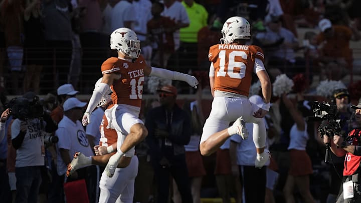 Texas Longhorns quarterback Arch Manning and defensive back Michael Taaffe react after a touchdown during the first half against the Arkansas Razorbacks at Darrell K Royal-Texas Memorial Stadium. Texas Longhorns quarterback Arch Manning and defensive back Michael Taaffe react after a touchdown during the first half against the Arkansas Razorbacks at Darrell K Royal-Texas Memorial Stadium.