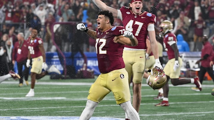 Dec 2, 2023; Charlotte, NC, USA; Florida State Seminoles offensive lineman Julian Armella (72) and tight end Jimmy Casey (47) celebrate winning the ACC Championship against the Louisville Cardinals at Bank of America Stadium. Mandatory Credit: Bob Donnan-Imagn Images