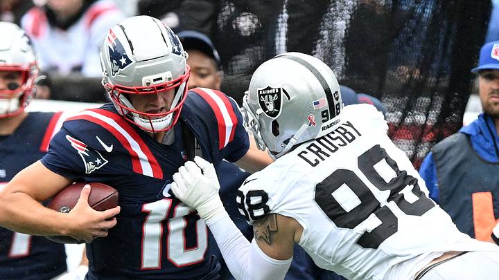Sep 7, 2025; Foxborough, Massachusetts, USA; New England Patriots quarterback Drake Maye (10) rushes the ball against Las Vegas Raiders defensive end Maxx Crosby (98) in the first half at Gillette Stadium. Mandatory Credit: Brian Fluharty-Imagn Images Sep 7, 2025; Foxborough, Massachusetts, USA; New England Patriots quarterback Drake Maye (10) rushes the ball against Las Vegas Raiders defensive end Maxx Crosby (98) in the first half at Gillette Stadium. Mandatory Credit: Brian Fluharty-Imagn Images