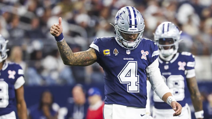 Dallas Cowboys quarterback Dak Prescott signals towards the sideline following a play against the Los Angeles Chargers at AT&T Stadium. 