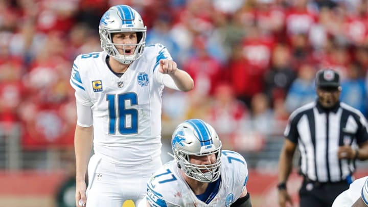 Detroit Lions quarterback Jared Goff (16) talks to center Frank Ragnow (77) before a snap against San Francisco 49ers