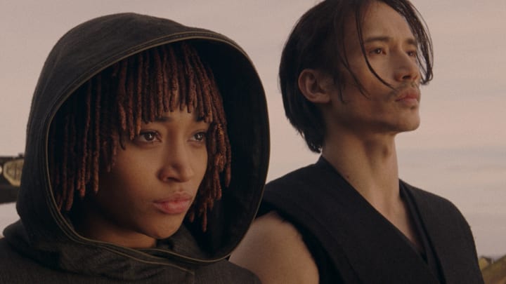 (L-R): Osha Aniseya (Amandla Stenberg) and the Stranger Qimir (Manny Jacinto) in Lucasfilm's Star Wars: THE ACOLYTE, season one, exclusively on Disney+. ©2024 Lucasfilm Ltd. & TM. All Rights Reserved.
