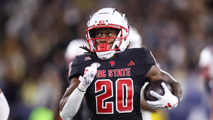 Nov 21, 2024; Atlanta, Georgia, USA; North Carolina State Wolfpack running back Hollywood Smothers (20) runs the ball for a touchdown against the Georgia Tech Yellow Jackets in the fourth quarter at Bobby Dodd Stadium at Hyundai Field. Mandatory Credit: Brett Davis-Imagn Images Nov 21, 2024; Atlanta, Georgia, USA; North Carolina State Wolfpack running back Hollywood Smothers (20) runs the ball for a touchdown against the Georgia Tech Yellow Jackets in the fourth quarter at Bobby Dodd Stadium at Hyundai Field. Mandatory Credit: Brett Davis-Imagn Images