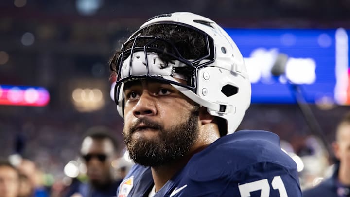 Dec 31, 2024; Glendale, AZ, USA; Penn State Nittany Lions offensive lineman Olaivavega Ioane (71) against the Boise State Broncos during the Fiesta Bowl at State Farm Stadium. Mandatory Credit: Mark J. Rebilas-Imagn Images