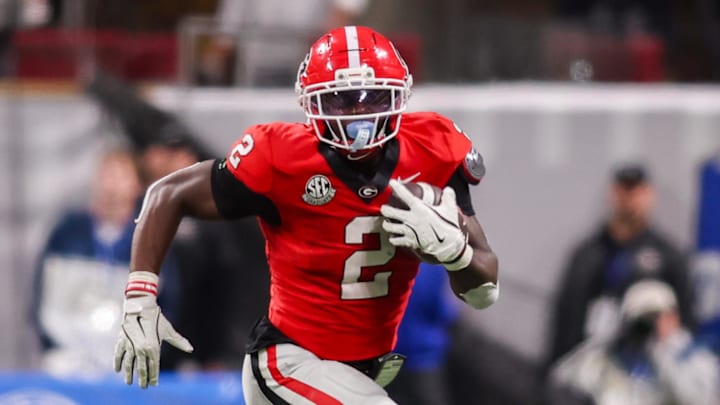 Nov 28, 2025; Atlanta, Georgia, USA; Georgia Bulldogs running back Josh McCray (2) runs the ball against the Georgia Tech Yellow Jackets in the fourth quarter at Mercedes-Benz Stadium. Mandatory Credit: Brett Davis-Imagn Images
