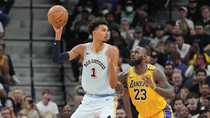 Nov 27, 2024; San Antonio, Texas, USA; San Antonio Spurs center Victor Wembanyama (1) handles the ball in front of Los Angeles Lakers forward LeBron James (23) in the second half at Frost Bank Center. Mandatory Credit: Daniel Dunn-Imagn Images Nov 27, 2024; San Antonio, Texas, USA; San Antonio Spurs center Victor Wembanyama (1) handles the ball in front of Los Angeles Lakers forward LeBron James (23) in the second half at Frost Bank Center. Mandatory Credit: Daniel Dunn-Imagn Images
