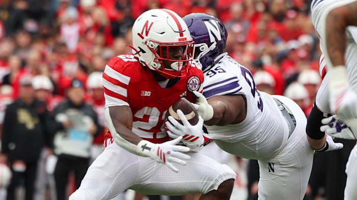 Emmett Johnson runs the ball against Northwestern. Emmett Johnson runs the ball against Northwestern.