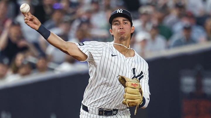 May 2, 2025; Bronx, New York, USA; New York Yankees third baseman Oswaldo Cabrera (95) throws the ball to first base for an out during the fourth inning against the Tampa Bay Rays at Yankee Stadium. Mandatory Credit: Vincent Carchietta-Imagn Images